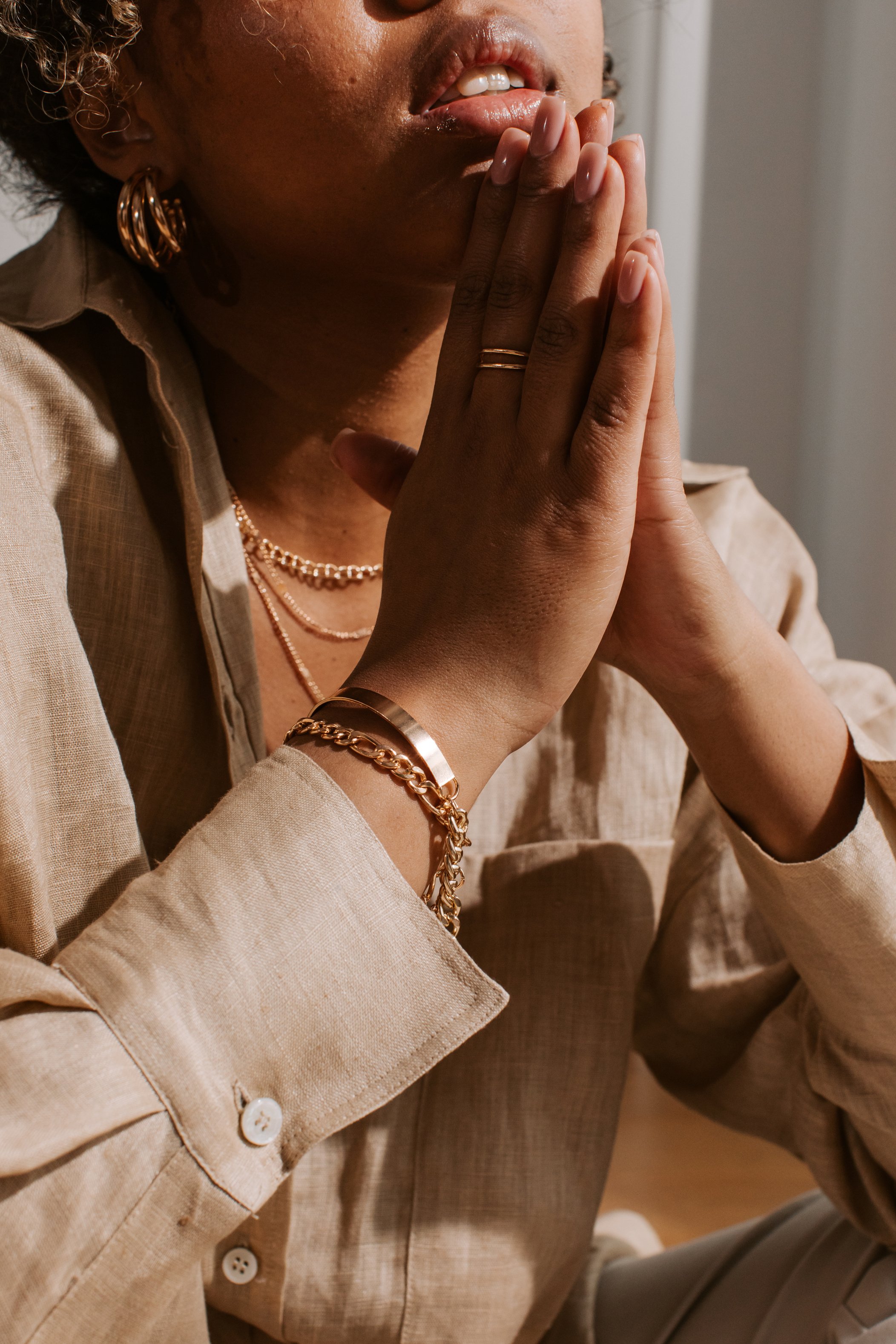 Woman Wearing Gold Jewelry